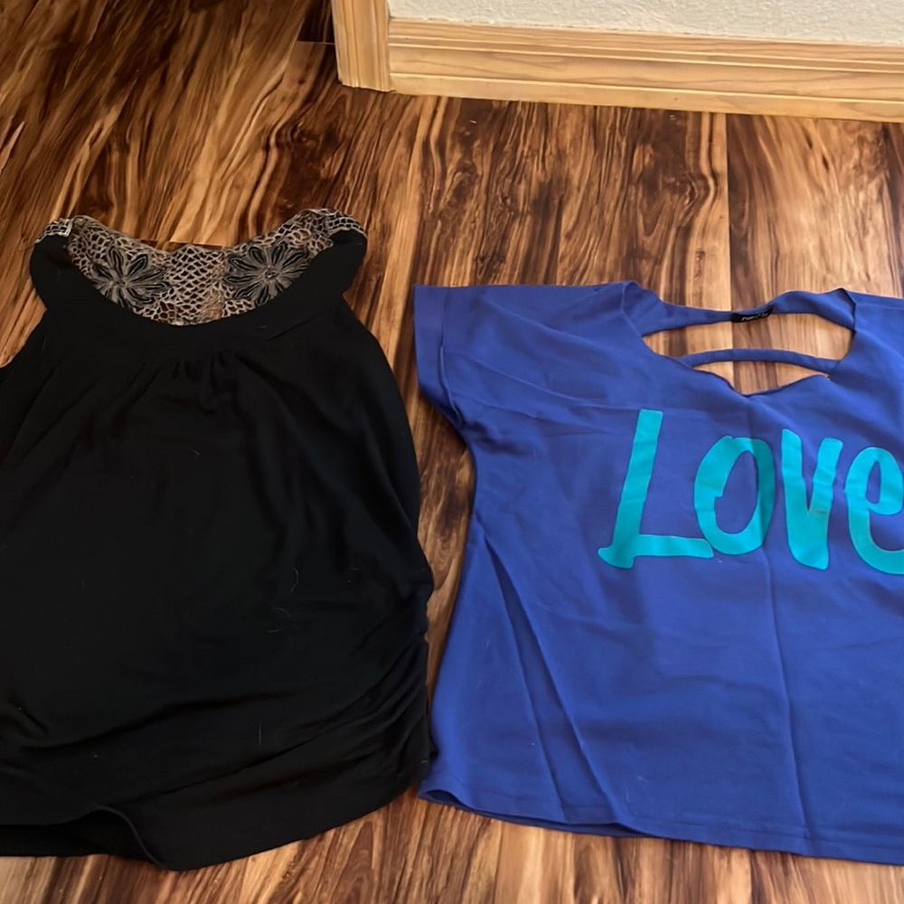 2 shirts size medium one from rue 21 and one from day trip
